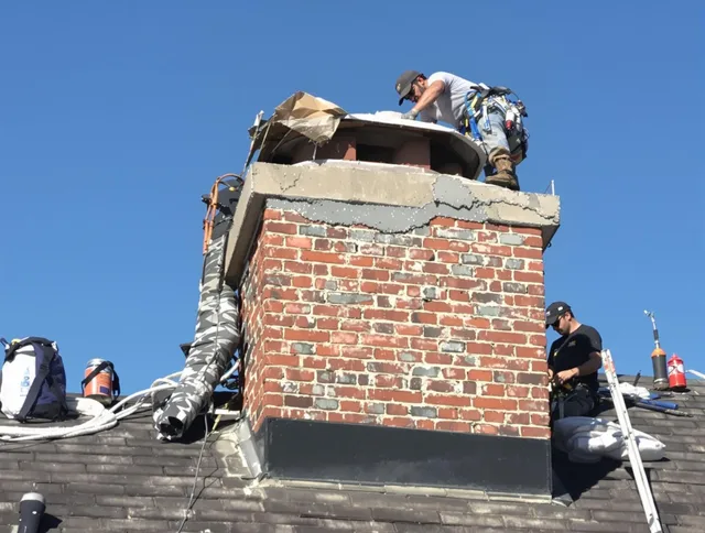 Norton Chimney Sweep installing a custom chimney crown in Norton, MA
