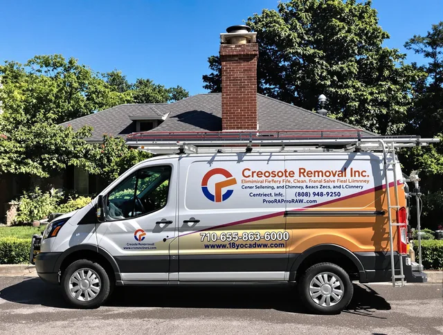 Norton Chimney Sweep technician removing creosote safely in Norton, MA