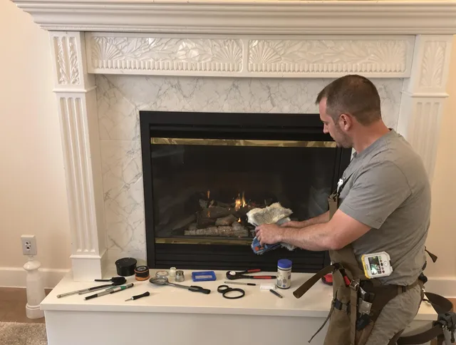 Norton Chimney Sweep performing fireplace maintenance in Norton, MA