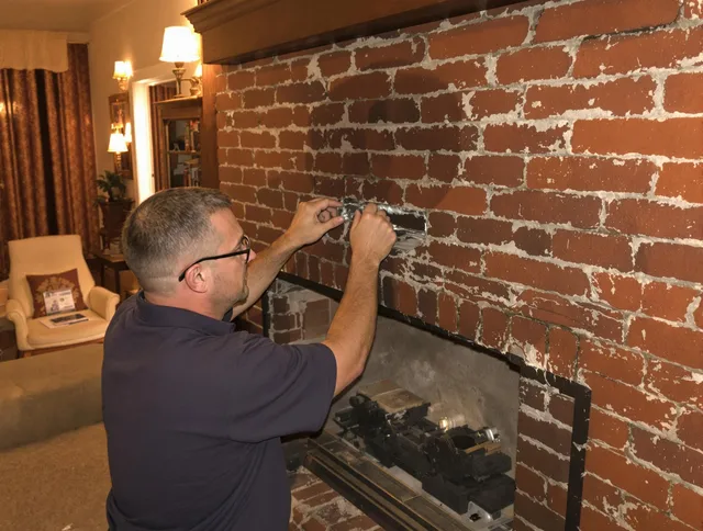 Norton Chimney Sweep expert fixing a fireplace in Norton, MA